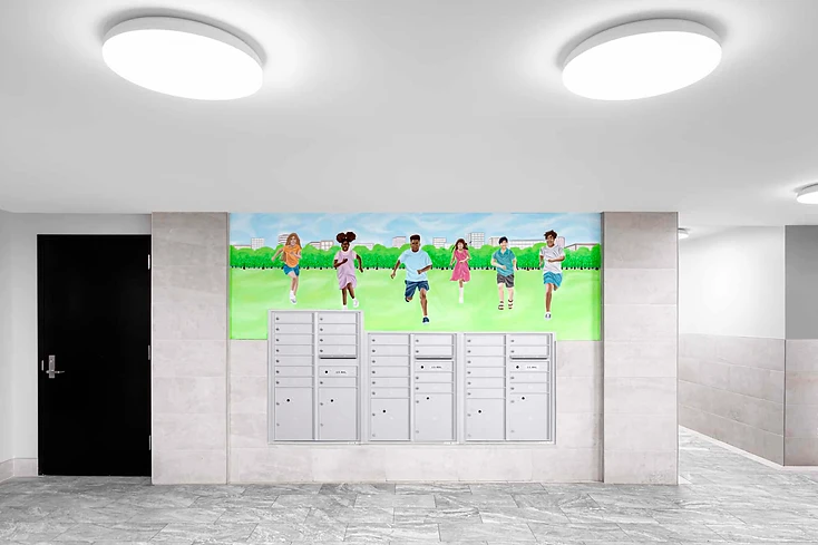 Renovated lobby with new mailboxes and resident mural at 955 Rutland Road, Brooklyn