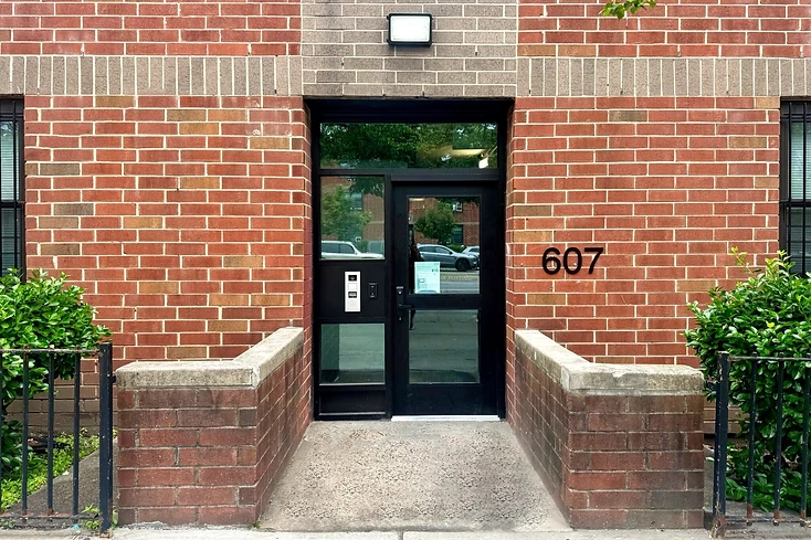 New building entrance and intercom at 607 Howard Avenue, part of the Reid and Park Rock rehabilitation