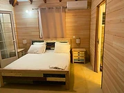 The bedroom with its time-worn timber furniture