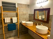 The bathroom, double vanity and exotic wood