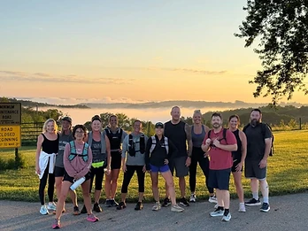 Winona Trail Runners crew gathered at sunrise on the bluffs