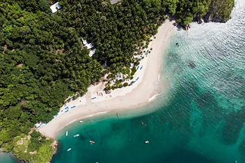 Aerial view of a turquoise Pacific cove in Costa Rica