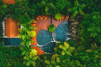 Amor Arenal — boutique luxury hotel pool surrounded by rainforest near Arenal Volcano