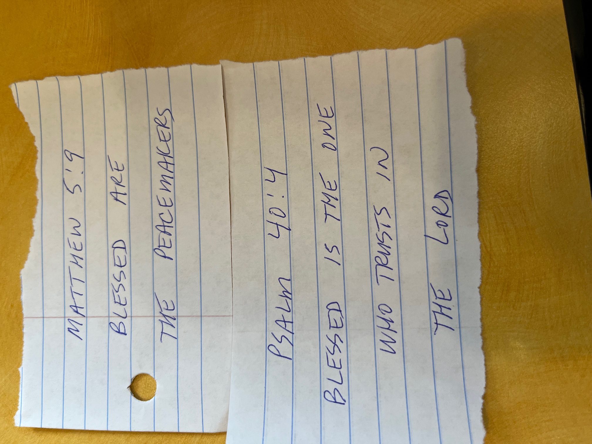 The first Verse Scraps — torn notebook paper with handwritten Scripture