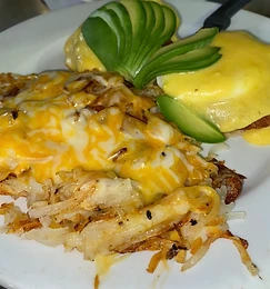 Eggs Benedict with cheesy hash browns
