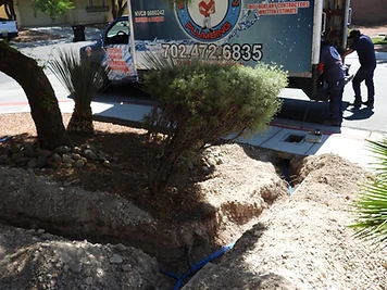 Second Opinion Plumbing work truck parked beside a freshly excavated water-main trench at a residential driveway.