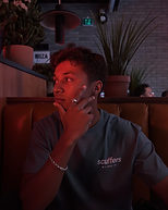 Directed photo — red-lit restaurant booth