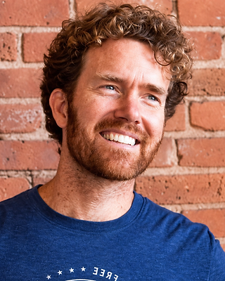 Portrait of John Jacobs, Co-Founder & CCO of Life is Good