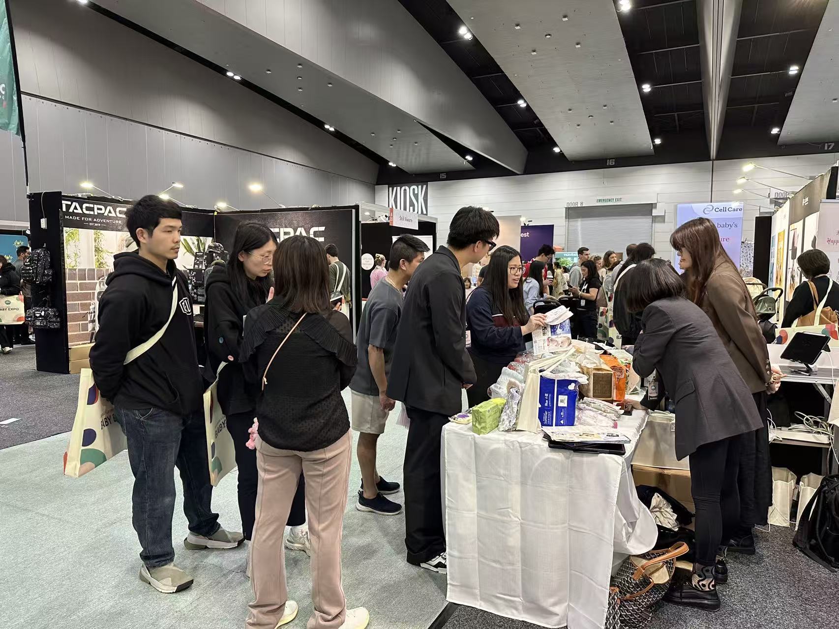 Families visiting the TheBabyIsland booth at the baby expo