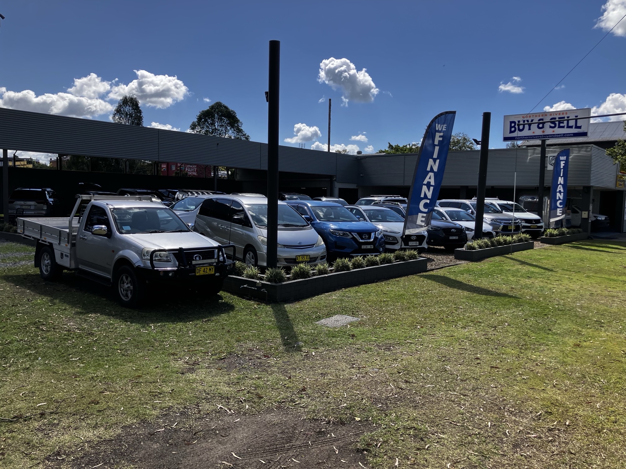 Northern Rivers Buy & Sell car yard with We Finance banners