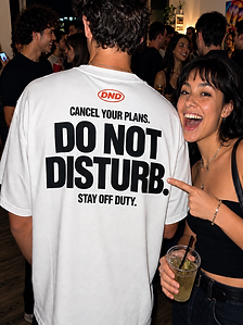 DND white tee at an off-duty house party