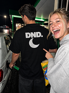 DND streetwear at a nighttime petrol station