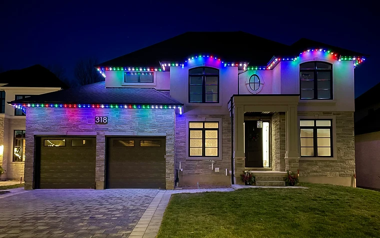 Color-changing permanent LED lighting on a two-storey Ontario home