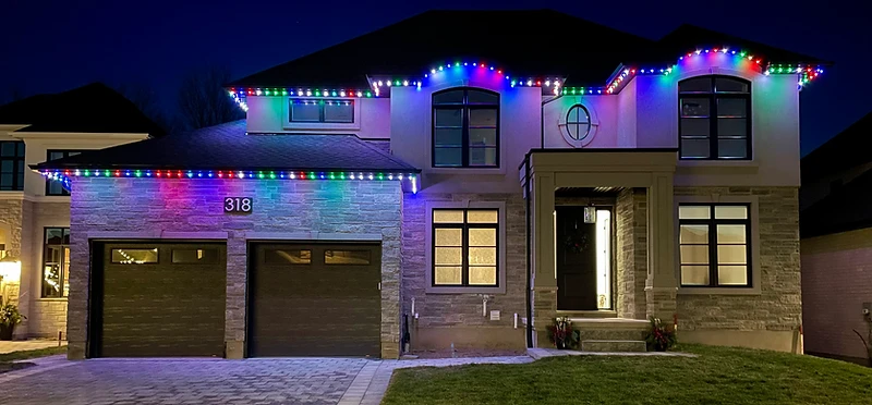 Color-changing permanent LED lighting on a residential home exterior