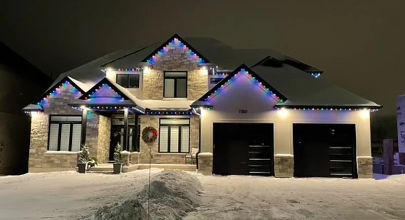 Color-changing permanent LED lighting on a residential home exterior