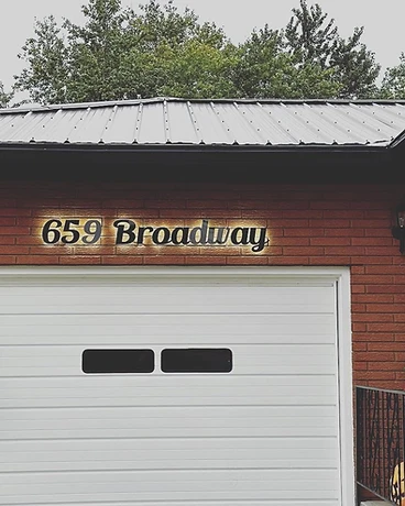 659 Broadway — Serif on Brick — GoBright permanent lighting installation