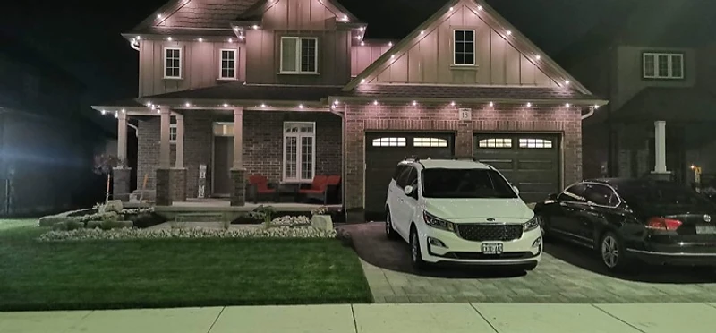 Permanent roofline lighting on a brick home in Ontario