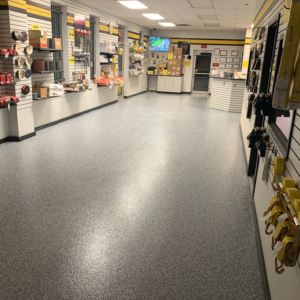 Finished glossy epoxy floor reflecting window light