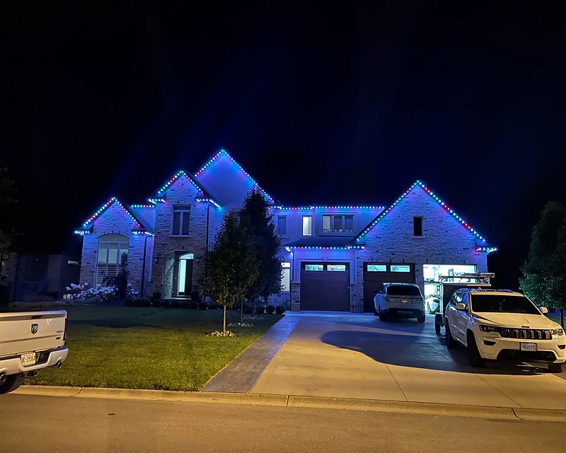 Permanent roofline lighting installation on a luxury home in Ontario