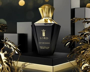 Perfume bottle on a gold-trimmed pedestal framed by metallic gold leaves