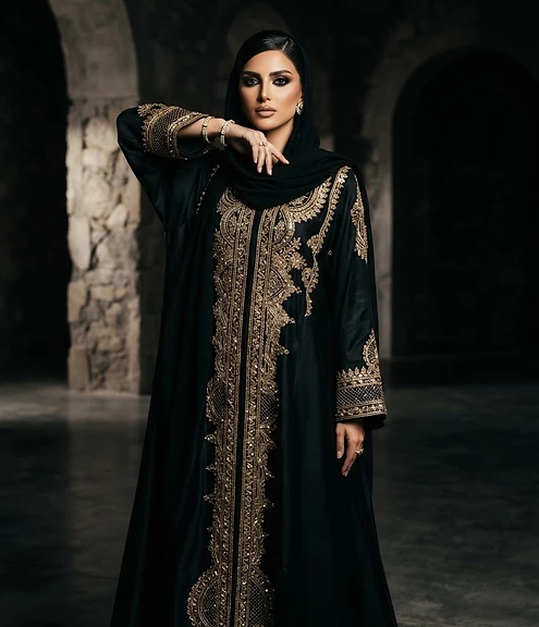 Fashion photographer shooting an editorial lookbook set with studio lighting in Riyadh