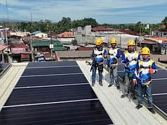 Harnessed crew on a rooftop solar install in Baloi, Lanao Del Norte