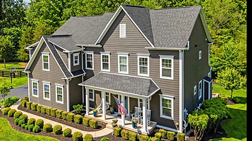 A two-story Northern Virginia home with a covered front entrance and manicured landscaping.