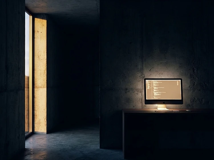Brutalist office with a single glowing terminal
