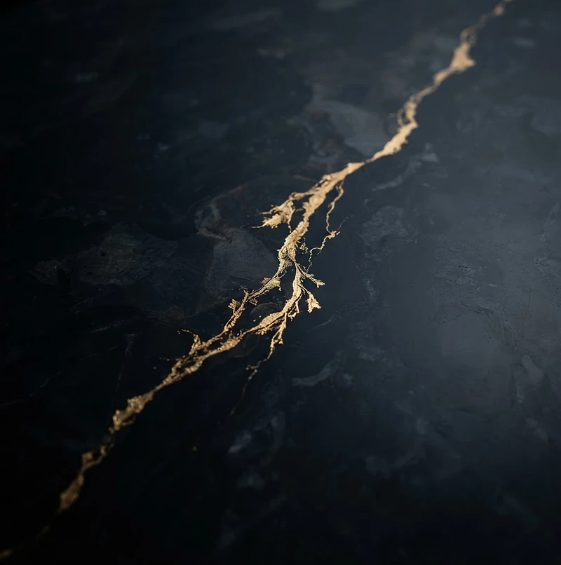 Gold vein through black marble