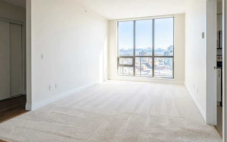 Empty freshly cleaned Calgary apartment carpet ready for move-in