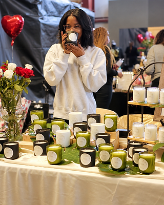 The Simply Elegant Candles founder at her candle-making worktable