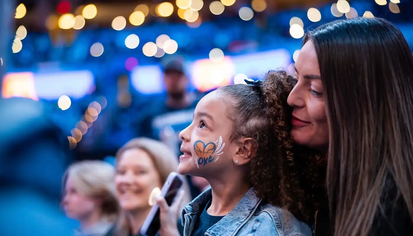 Woman and child enjoying an Oklahoma City event with face paint