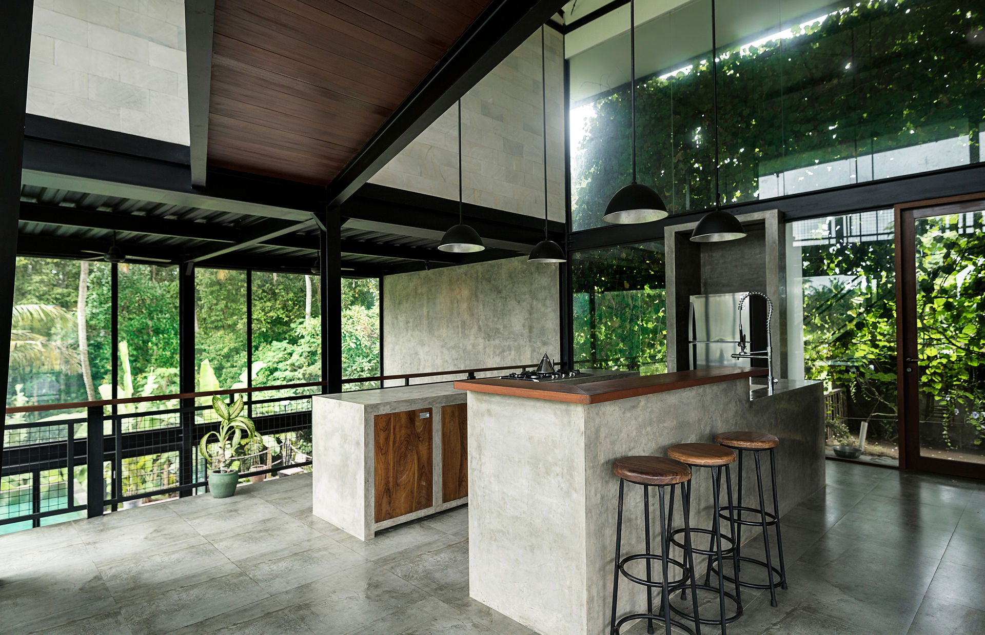Luxurious modern kitchen with wraparound glass windows