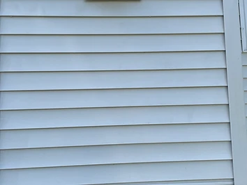 Clean vinyl siding and exterior wall after a soft wash