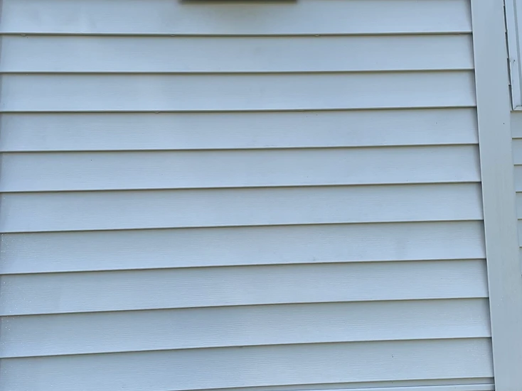 Clean vinyl siding and exterior wall after a soft wash