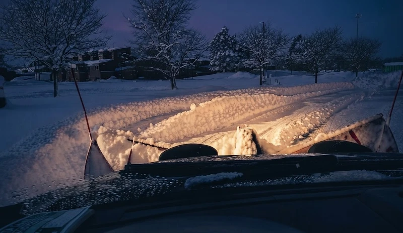 Tor Snow Removal in-cab plowing view at dawn