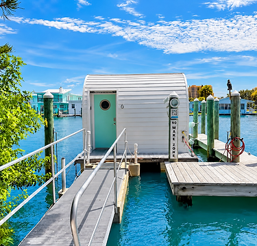 Floating cabin on a turquoise Clearwater canal