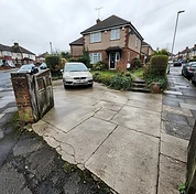 Concrete driveway after cleaning with a more even, cleaner surface