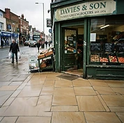 Shop entrance and paved forecourt after cleaning with a brighter, cleaner surface