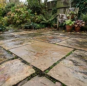 Indian sandstone patio after cleaning with more of the natural stone variation visible