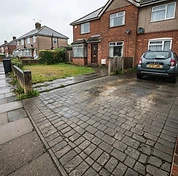 Block paving driveway after cleaning with the block colour restored and joints ready for re-sanding