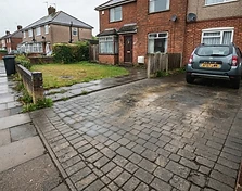Block paving driveway after cleaning with the block colour restored and joints clear