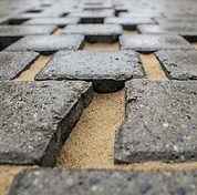 Block paving joints refilled with kiln-dried sand after re-sanding