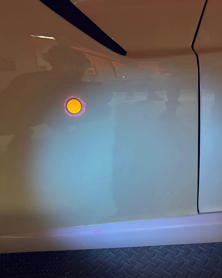 UV light versus normal light comparison on a vehicle panel