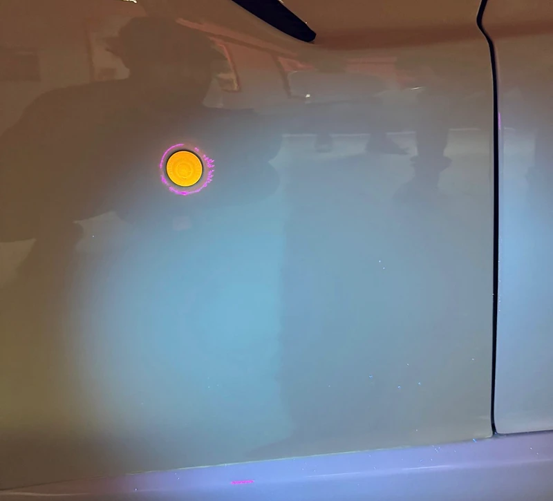 UV light inspection of a vehicle panel