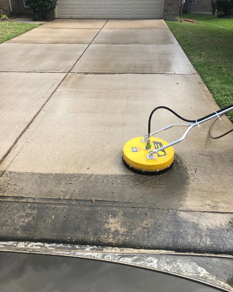 Driveway pressure washing by YC Construction Enterprise