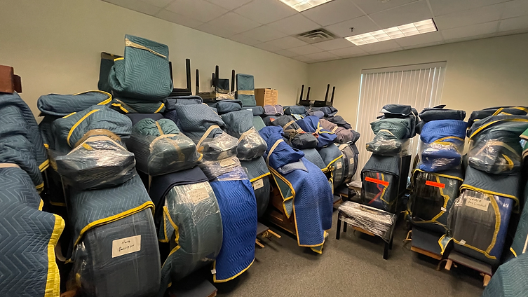 Climate-controlled piano storage facility with wrapped grand and upright pianos