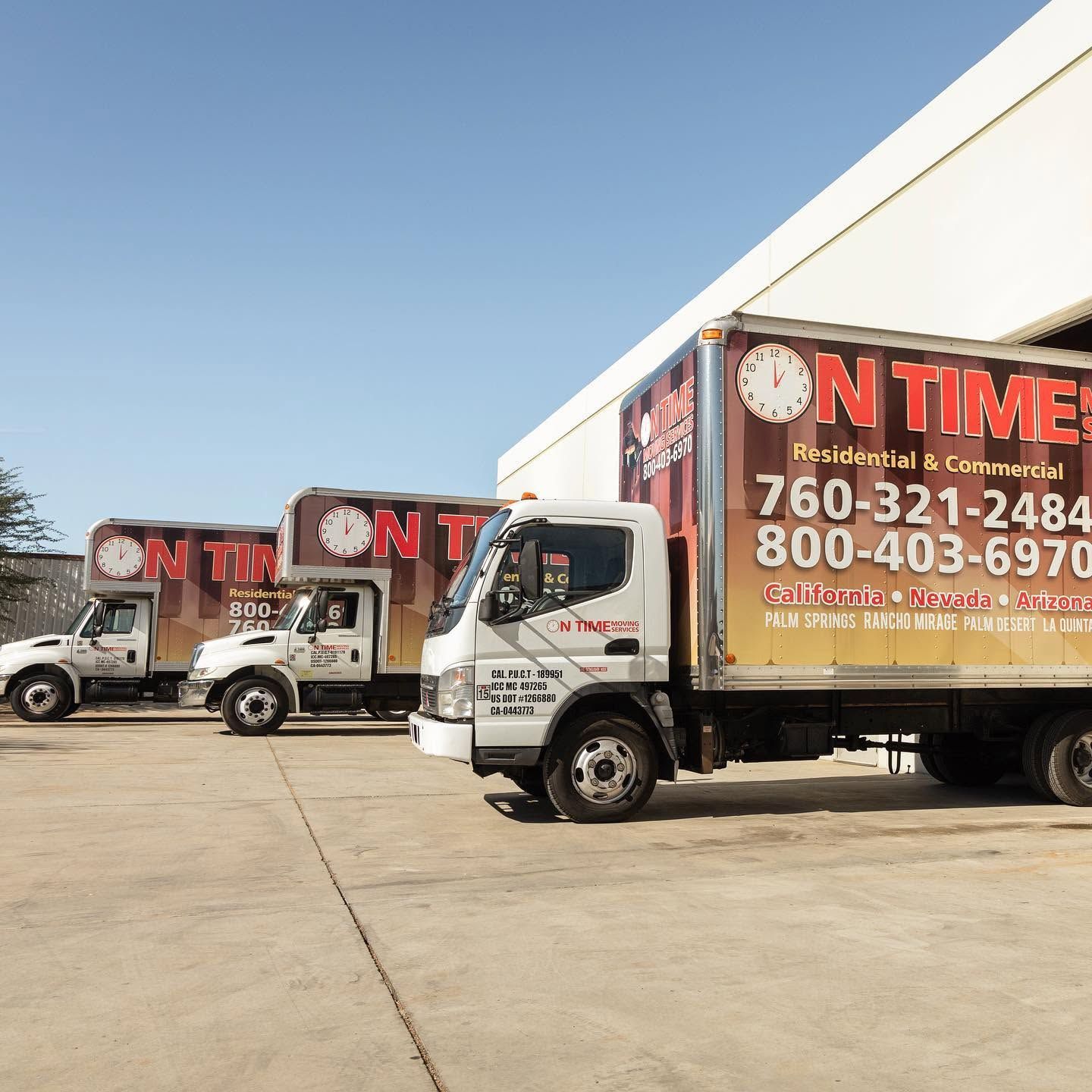 On Time Moving Services truck parked at a luxury estate at golden hour