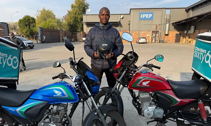 Scooter Lab delivery rider with a Honda Ace rental motorcycle in Potchefstroom