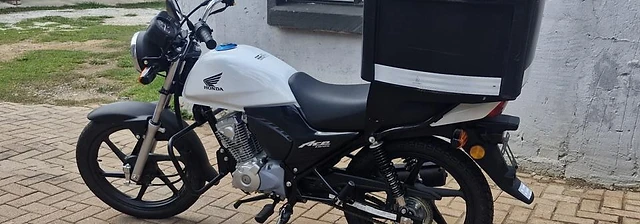 Scooter Lab delivery rider with a serviced Honda Ace motorcycle in Potchefstroom